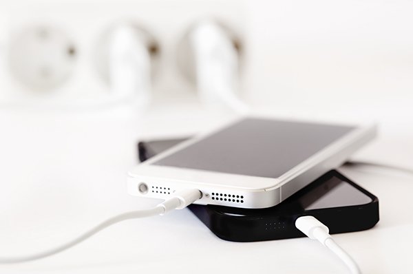 2 phones charging by wallsocket