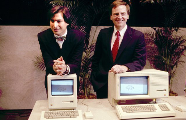 Apple CEO Steven P. Jobs, left and President John Sculley present the new Macintosh Desktop Computer in January 1984 at a shareholder meeting in Cupertino, California, USA. (AP Photo)