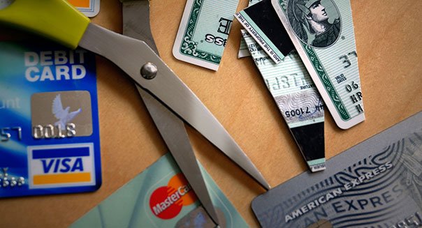 ANJ67M Cutting up credit cards. Image shot 2008. Exact date unknown.