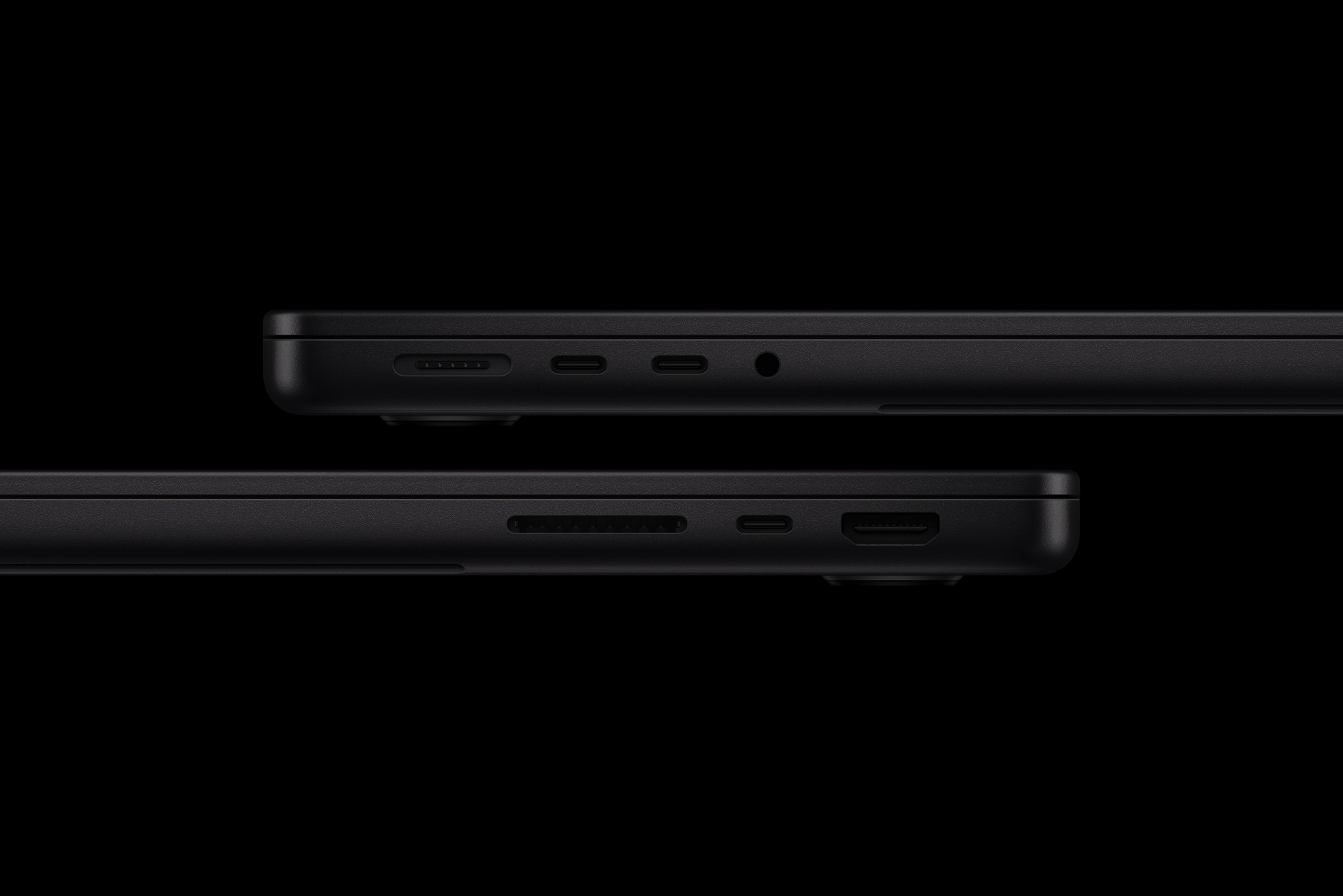 Two sides of the new 14-inch MacBook Pro show the laptop’s array of ports.